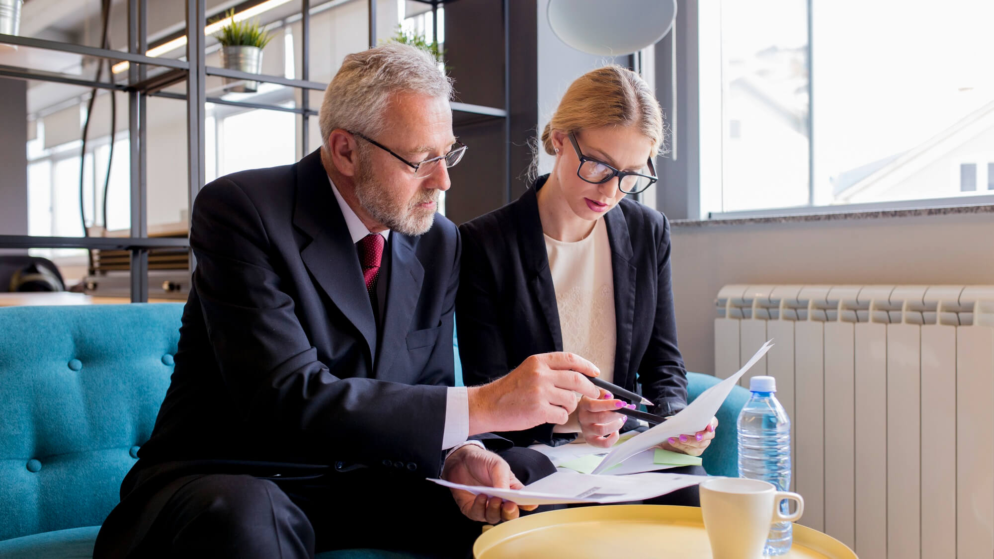Two People Reviewing legal documents in an office